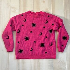 Vibrant Pink Sweater with Black Sun Moon and Stars